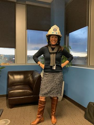 MSU President Dr. Janine Davidson in a fire helmet.