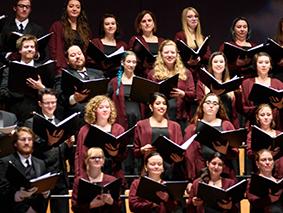 MSU Denver Chorale singing with songbooks