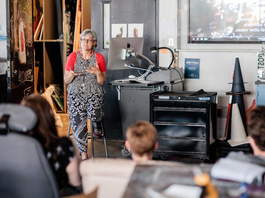MSU Denver professor, Anne Thulson, speaks to her Painting and New Contexts class on May 3, 2023. Photo by Alyson McClaran