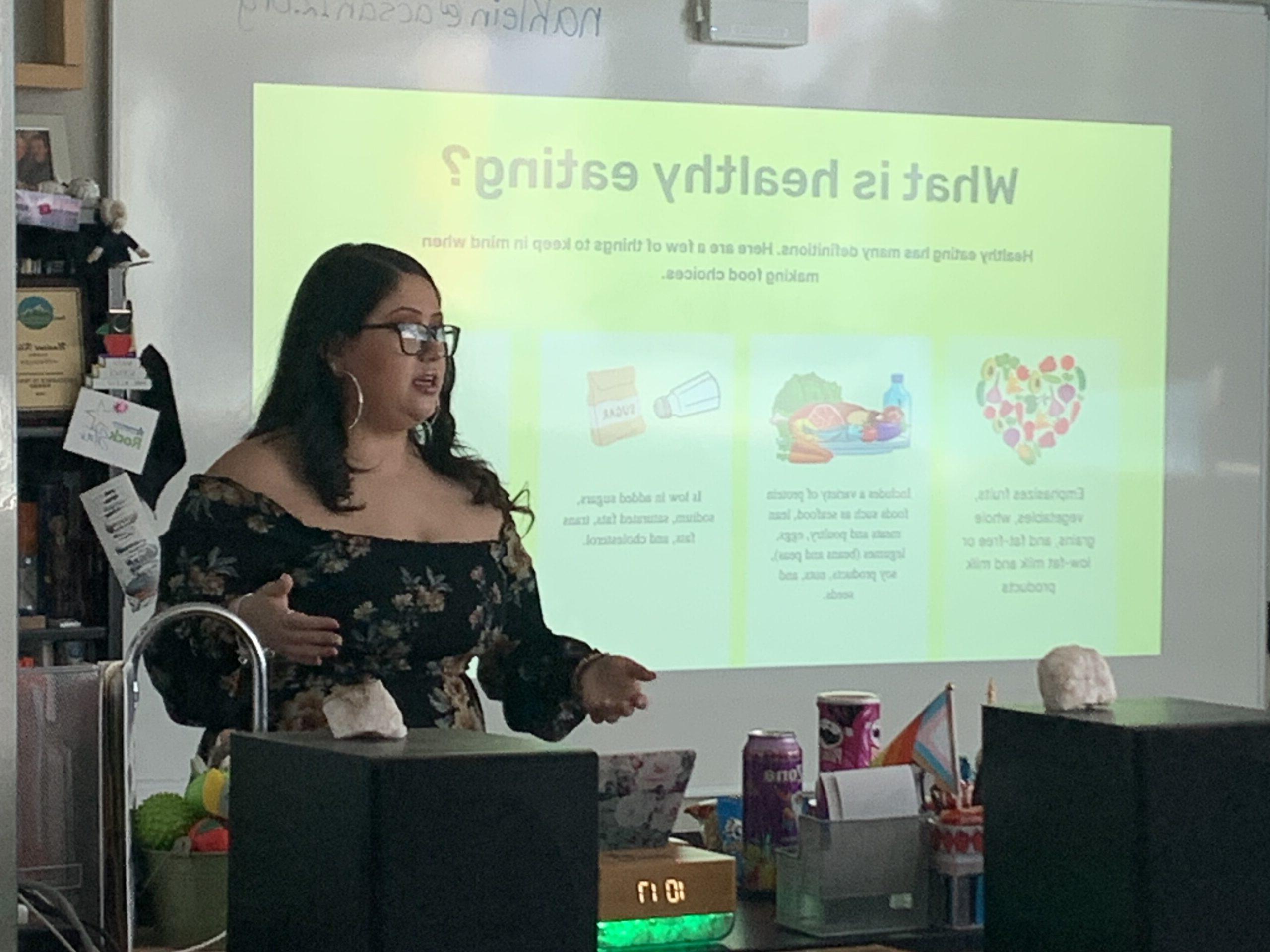 A photo of a student giving a presentation on healthy eating.
