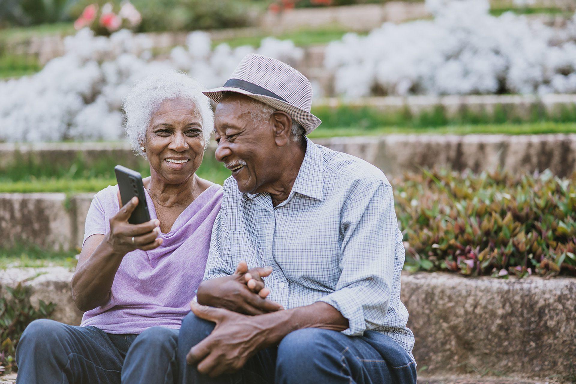 Older adults looking at cell phone