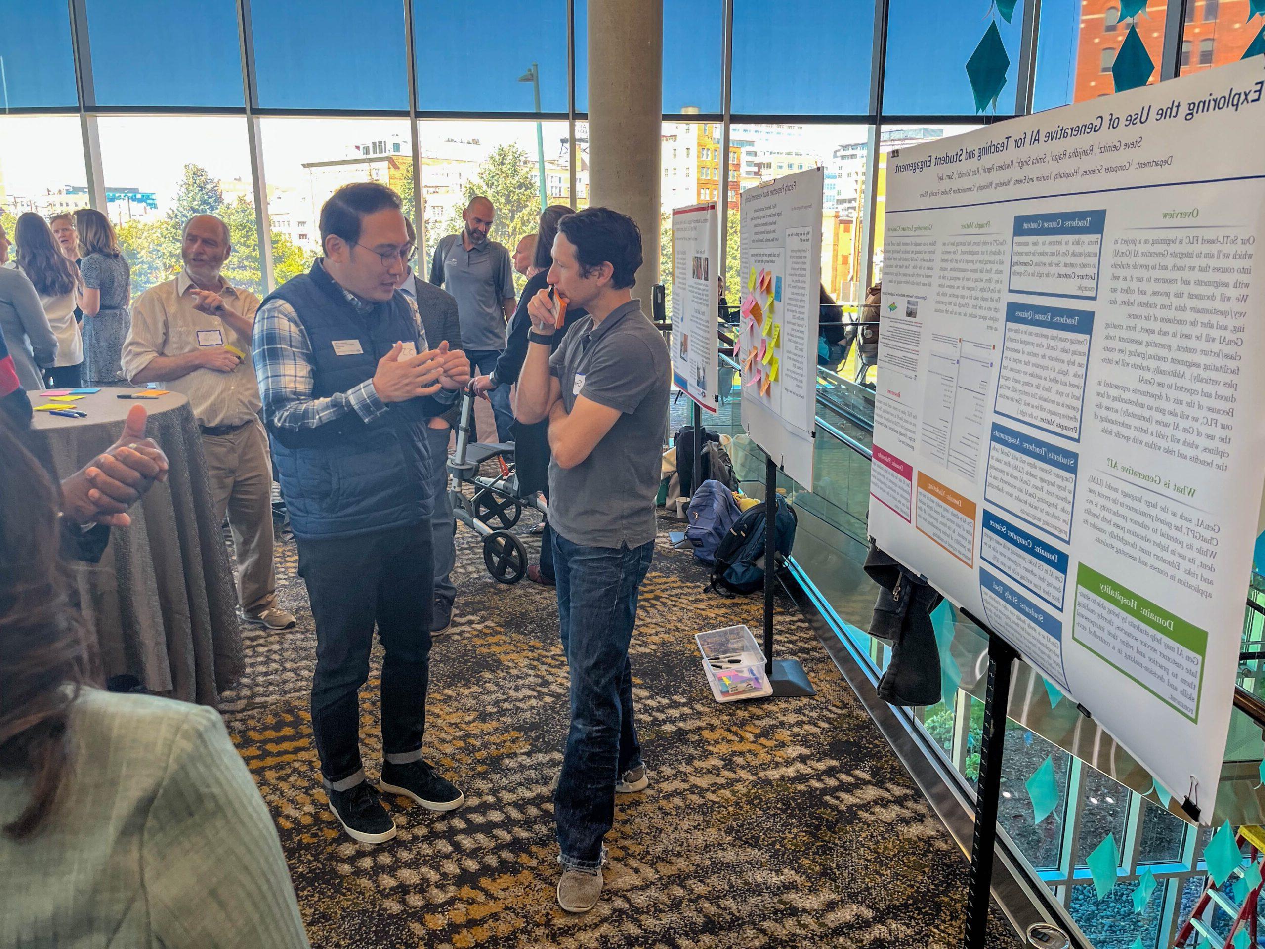 Faculty and staff discussing research projects at the SoTL poster session